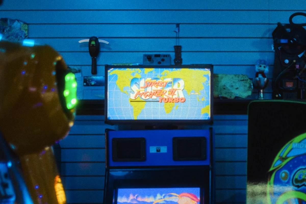 A Street Fighter II cabinet re-lit through a coin-op slot mask — Original
